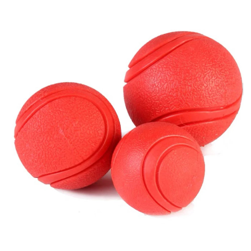 Pelota maciza de goma para juegos con perros