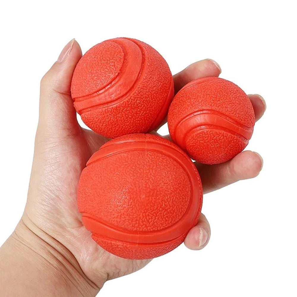 Pelota maciza de goma para juegos con perros